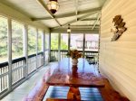 Screened porch, hand-carved pine table, seats 12